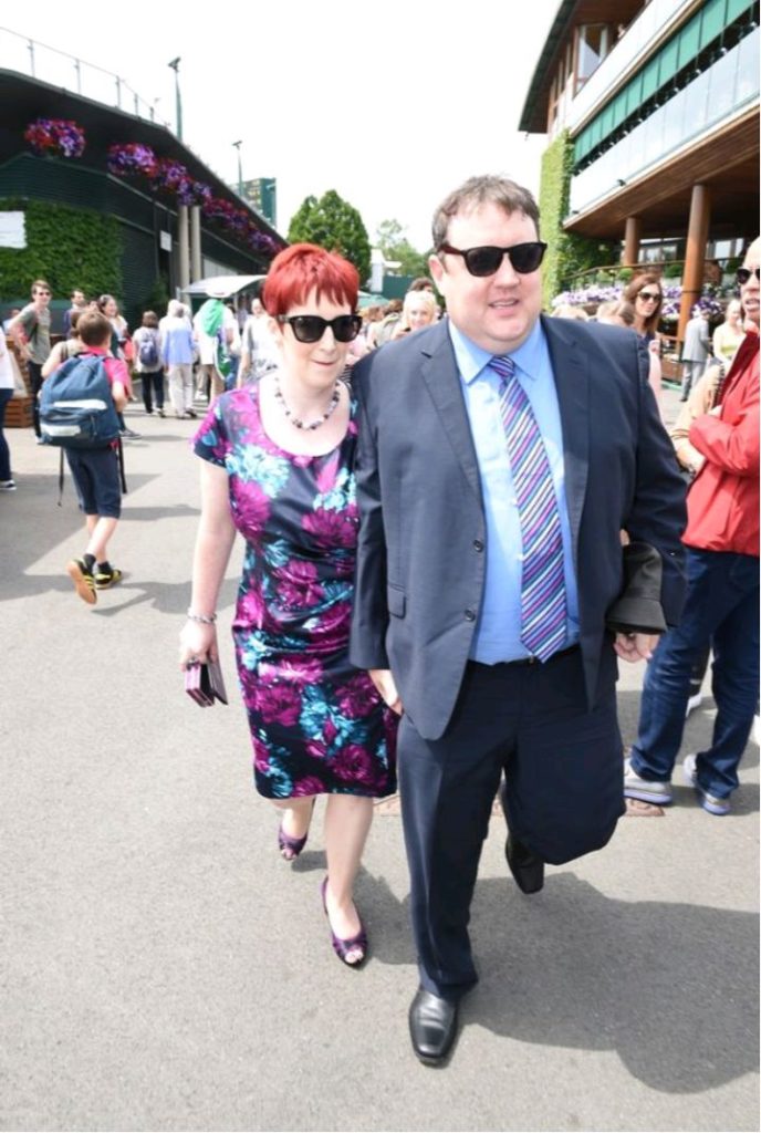 Peter Kay and his wife Susan Gargan holding hands while walking on the streets. Image credit: Manchester Evening News 